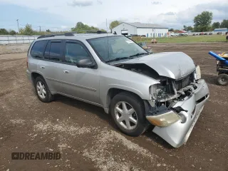 2007 GMC Envoy SLT with VIN 1GKDT13S272265100, listed as a Copart auction lot 73136264 with 245,198 mi miles and Salvage Title. Bid and sale history available at carsss.com. Image 4.