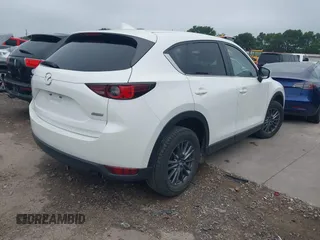 2017 Mazda CX-5 Touring z VIN JM3KFBCL5H0128584, wystawiony jako IAAI lot #42354669 z przebiegiem 56 563 mil mil oraz . Historia ofert i sprzedaży dostępna na DreamBid. Obrazek 4.