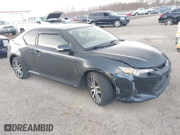 2015 Scion tC with VIN JTKJF5C7XFJ001662, listed as a IAAI auction lot 41843123 with 128,851 mi miles. Bid and sale history available at carsss.com. Image 1.