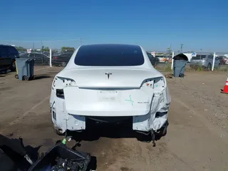 2022 Tesla Model Y Long Range with VIN 7SAYGDEE1NF364241, listed as a IAAI auction lot 42190272 with 54,878 mi miles and . Bid and sale history available at DreamBid. Image 16.