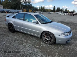 2000 Audi S4 z VIN WAUDD68D7YA179687, wystawiony jako Copart lot #77201694 z przebiegiem 165 118 mil mil oraz Szkody całkowita. Historia ofert i sprzedaży dostępna na DreamBid. Obrazek 4.