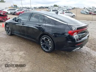 2023 Kia K5 GT-Line z VIN 5XXG64J28PG206566, wystawiony jako IAAI lot #41816536 z przebiegiem 30 952 mil mil oraz . Historia ofert i sprzedaży dostępna na DreamBid. Obrazek 3.