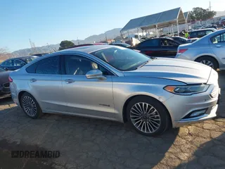 2017 Ford Fusion Hybrid Titanium with VIN 3FA6P0RU8HR190482, listed as a IAAI auction lot 41322244 with 137,539 mi miles and . Bid and sale history available at DreamBid. Image 13.