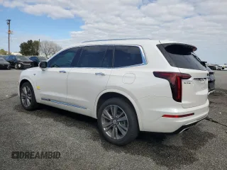 2021 Cadillac XT6 Premium Luxury z VIN 1GYKPCRSXMZ230618, wystawiony jako Copart lot #81022824 z przebiegiem Nie podano mil oraz Szkoda całkowita • Salvage title. Historia ofert i sprzedaży dostępna na DreamBid. Obrazek 2.