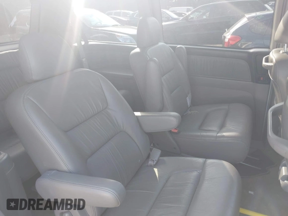 2003 Honda Odyssey EX-L with VIN 5FNRL18913B061340, listed as a IAAI auction lot 42633790 with 1,281,195 mi miles and . Bid and sale history available at DreamBid. Image 8.