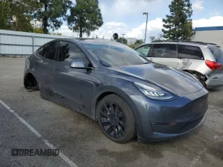 2021 Tesla Model Y Long Range with VIN 5YJYGDEE6MF200883, listed as a Copart auction lot 51707405 with 59,820 mi miles and Salvage Title. Bid and sale history available at DreamBid. Image 4.