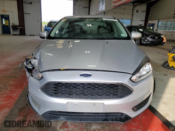 2018 Ford Focus SE with VIN 1FADP3F23JL214008, listed as a Copart auction lot 59692045 with 57,247 mi miles and Salvage title. Bid and sale history available at DreamBid. Image 5.
