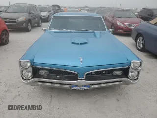 1967 Pontiac GTO z VIN 242177Z109196, wystawiony jako Copart lot #74348844 z przebiegiem Nie podano mil oraz Szkoda całkowita • Salvage title. Historia ofert i sprzedaży dostępna na DreamBid. Obrazek 5.