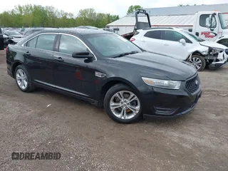 2013 Ford Taurus SEL z VIN 1FAHP2E87DG203558, wystawiony jako IAAI lot #42177548 z przebiegiem 123 264 mil mil oraz . Historia ofert i sprzedaży dostępna na DreamBid. Obrazek 1.
