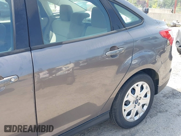 2012 Ford Focus SE with VIN 1FAHP3F25CL260962, listed as a IAAI auction lot 42588485 with 143,679 mi miles and . Bid and sale history available at DreamBid. Image 6.