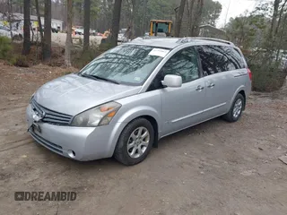2009 Nissan Quest SL with VIN 5N1BV28U59N105982, listed as a IAAI auction lot 41795063 with 127,008 mi miles. Bid and sale history available at carsss.com. Image 2.