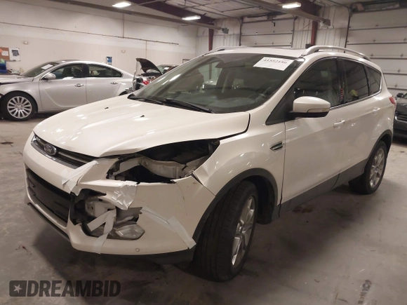 2014 Ford Escape Titanium with VIN 1FMCU9J9XEUE26857, listed as a IAAI auction lot 41552186 with 142,045 mi miles. Bid and sale history available at carsss.com. Image 2.
