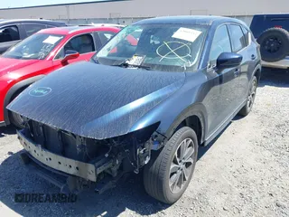 2023 Mazda CX-5 S Premium with VIN JM3KFBDM4P0185865, listed as a IAAI auction lot 42040234 with 32,761 mi miles and . Bid and sale history available at DreamBid. Image 20.