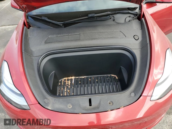 2021 Tesla Model Y Long Range with VIN 5YJYGDEEXMF217816, listed as a Copart auction lot 51008665 with 57,392 mi miles and Salvage Title. Bid and sale history available at DreamBid. Image 12.
