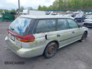 1998 Subaru Legacy L z VIN 4S3BK4353W7300794, wystawiony jako IAAI lot #42205793 z przebiegiem 227 539 mil mil oraz . Historia ofert i sprzedaży dostępna na DreamBid. Obrazek 4.