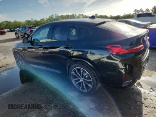 2021 BMW X4 M40i with VIN 5UX2V5C05M9F68427, listed as a Copart auction lot 64941095 with 50,208 mi miles and Salvage title. Bid and sale history available at DreamBid. Image 2.
