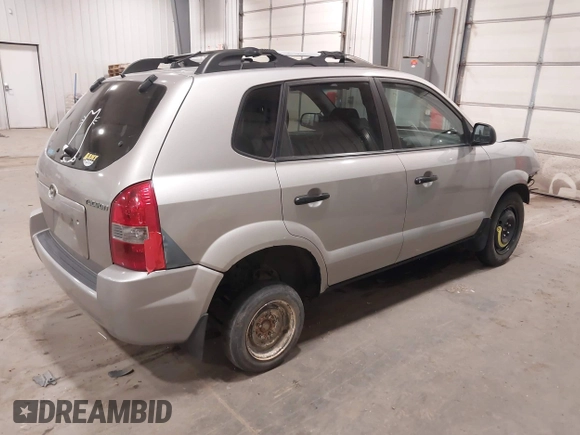 2006 Hyundai Tucson GL with VIN KM8JM12BX6U250937, listed as a IAAI auction lot 41529567 with 165,528 mi miles. Bid and sale history available at carsss.com. Image 4.