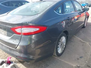 2016 Ford Fusion SE Hybrid with VIN 3FA6P0LU7GR218781, listed as a IAAI auction lot 41844791 with 214,867 mi miles. Bid and sale history available at carsss.com. Image 4.