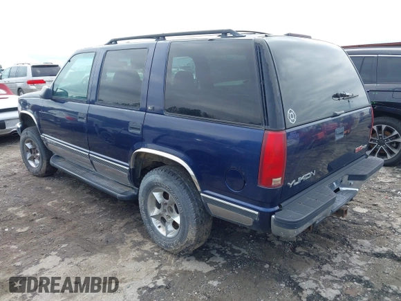 1997 GMC Yukon with VIN 1GKEK13R6VJ715421, listed as a IAAI auction lot 41811398 with 214,735 mi miles. Bid and sale history available at carsss.com. Image 3.