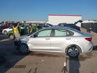 2023 Kia Rio S z VIN 3KPA24AD2PE545609, wystawiony jako IAAI lot #41993823 z przebiegiem 12 186 mil mil oraz . Historia ofert i sprzedaży dostępna na DreamBid. Obrazek 14.