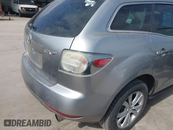 2010 Mazda CX-7 Touring z VIN JM3ER2W30A0319755, wystawiony jako IAAI lot #41786798 z przebiegiem 182 282 mil mil oraz . Historia ofert i sprzedaży dostępna na DreamBid. Obrazek 14.