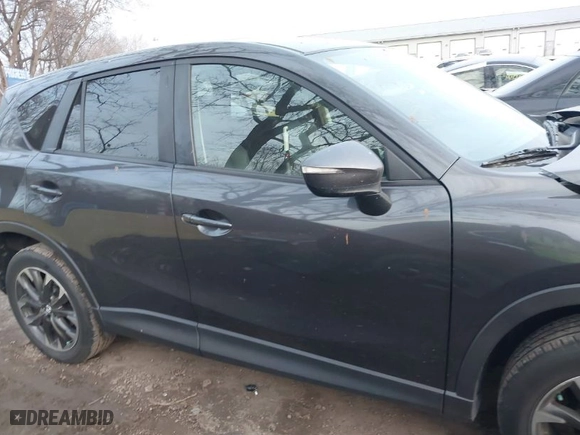 2016 Mazda CX-5 Grand Touring with VIN JM3KE4DYXG0684638, listed as a IAAI auction lot 41101563 with NaN miles. Bid and sale history available at carsss.com. Image 13.