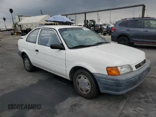 1996 Toyota Tercel DX z VIN JT2AC52L9T0189356, wystawiony jako Copart lot #75311564 z przebiegiem 155 248 mil mil oraz Szkody całkowita. Historia ofert i sprzedaży dostępna na DreamBid. Obrazek 4.