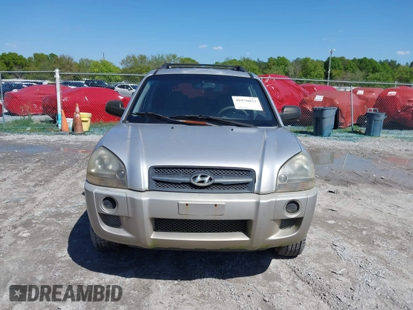 2006 Hyundai Tucson GL with VIN KM8JM12BX6U249982, listed as a IAAI auction lot 41976033 with 107,153 mi miles. Bid and sale history available at carsss.com. Image 12.