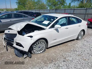 2013 Ford Fusion SE Hybrid z VIN 3FA6P0LU9DR349321, wystawiony jako IAAI lot #42156321 z przebiegiem 90 688 mil mil oraz . Historia ofert i sprzedaży dostępna na DreamBid. Obrazek 17.