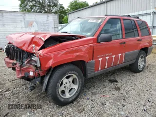 1997 Jeep Grand Cherokee Laredo with VIN 1J4GZ58S3VC739922, listed as a Copart auction lot 55667885 with 209,075 mi miles and Salvage title. Bid and sale history available at DreamBid. Image 1.