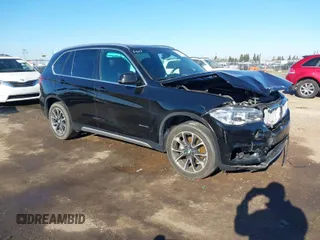 2018 BMW X5 xDrive35i with VIN 5UXKR0C59J0X87391, listed as a IAAI auction lot 41359822 with 73,913 mi miles. Bid and sale history available at carsss.com. Image 1.