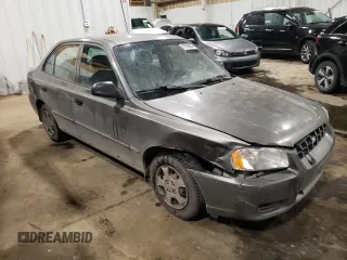 2000 Hyundai Accent z VIN KMHCG45G4YU090520, wystawiony jako Copart lot #79705864 z przebiegiem 145 490 mil mil oraz Szkoda całkowita • Salvage title. Historia ofert i sprzedaży dostępna na DreamBid. Obrazek 4.