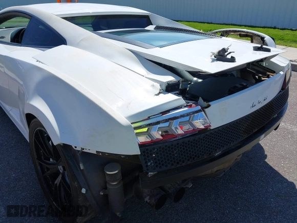 2009 Lamborghini Gallardo z VIN ZHWGU54T59LA07777, wystawiony jako IAAI lot #39749159 z przebiegiem 8730 mil mil oraz . Historia ofert i sprzedaży dostępna na DreamBid. Obrazek 6.