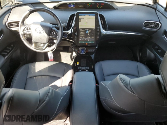 2021 Toyota Prius LE with VIN JTDKAMFP7M3185847, listed as a Copart auction lot 52897465 with 58,996 mi miles and Salvage Title. Bid and sale history available at DreamBid. Image 8.
