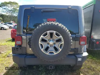 2014 Jeep Wrangler Unlimited Rubicon with VIN 1C4HJWFG7EL302897, listed as a Copart auction lot 48969425 with 57,976 mi miles and Salvage title. Bid and sale history available at DreamBid. Image 6.