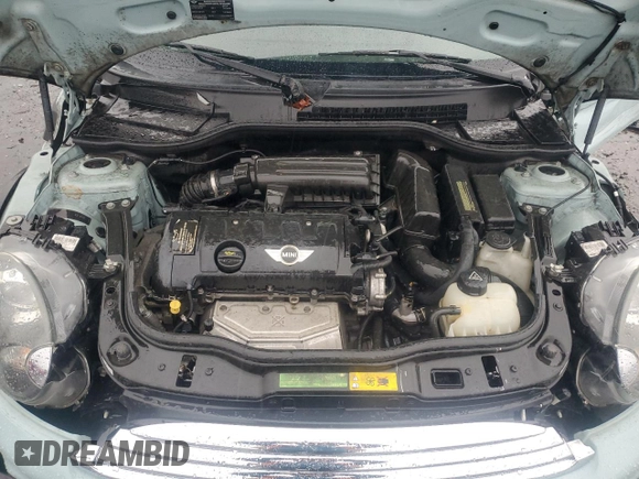 2011 MINI Hardtop with VIN WMWSU3C57BT096973, listed as a Copart auction lot 52726185 with 90,545 mi miles and Salvage title. Bid and sale history available at DreamBid. Image 12.