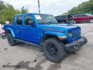 2023 Jeep Gladiator Mojave with VIN 1C6JJTEG0PL593061, listed as a IAAI auction lot 40287955 with 3,930 mi miles. Bid and sale history available at carsss.com. Image 1.