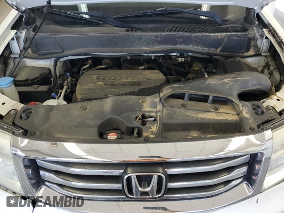 2014 Honda Pilot Touring z VIN 5FNYF4H99EB011079, wystawiony jako Copart lot #57869765 z przebiegiem Nie podano mil oraz Szkoda całkowita • Salvage title. Historia ofert i sprzedaży dostępna na DreamBid. Obrazek 12.