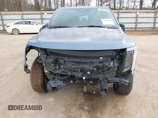 2023 Ford F-150 Lightning Pro with VIN 1FT6W1EVXPWG34958, listed as a IAAI auction lot 41732898 with 10,573 mi miles and . Bid and sale history available at DreamBid. Image 6.
