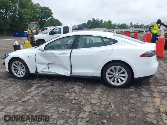 2016 Tesla Model S 70 with VIN 5YJSA1E11GF132984, listed as a IAAI auction lot 42428634 with Not provided miles and . Bid and sale history available at DreamBid. Image 13.