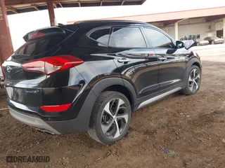 2017 Hyundai Tucson Value with VIN KM8J33A22HU316495, listed as a IAAI auction lot 41896507 with 82,517 mi miles. Bid and sale history available at carsss.com. Image 4.