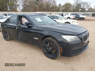 2015 BMW 7 Series 740i with VIN WBAYA6C58FD826880, listed as a IAAI auction lot 41360429 with 125,130 mi miles. Bid and sale history available at carsss.com. Image 1.
