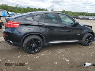 2012 BMW X6 50i z VIN 5UXFG8C51CLZ97393, wystawiony jako Copart lot #58407285 z przebiegiem 128 040 mil mil oraz Szkoda całkowita • Salvage title. Historia ofert i sprzedaży dostępna na DreamBid. Obrazek 3.
