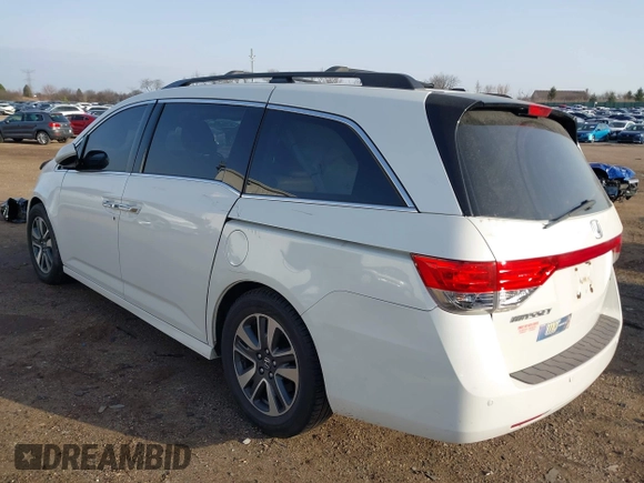 2014 Honda Odyssey Touring with VIN 5FNRL5H97EB037358, listed as a IAAI auction lot 41832825 with 208,894 mi miles and . Bid and sale history available at DreamBid. Image 3.