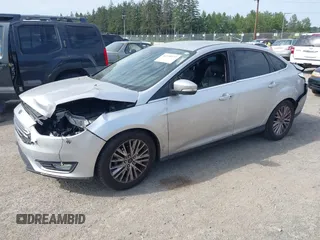 2016 Ford Focus Titanium with VIN 1FADP3J20GL238914, listed as a IAAI auction lot 42338977 with 126,276 mi miles and . Bid and sale history available at DreamBid. Image 2.