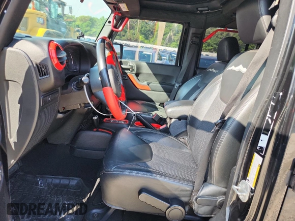 2015 Jeep Wrangler Unlimited Sahara with VIN 1C4BJWEG6FL643460, listed as a Copart auction lot 58557765 with 130,181 mi miles and Salvage title. Bid and sale history available at DreamBid. Image 7.