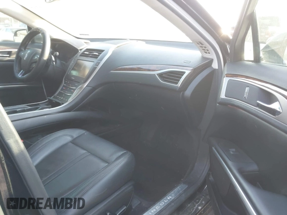 2015 Lincoln MKZ z VIN 3LN6L2J96FR619104, wystawiony jako IAAI lot #41794707 z przebiegiem 140 899 mil mil oraz . Historia ofert i sprzedaży dostępna na DreamBid. Obrazek 5.