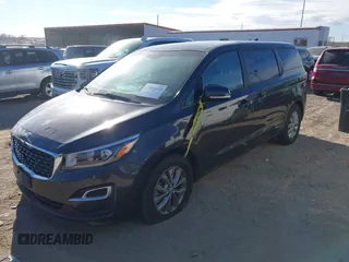 2021 Kia Sedona EX with VIN KNDMB5C19M6671229, listed as a IAAI auction lot 41066675 with 168,393 mi miles. Bid and sale history available at carsss.com. Image 2.