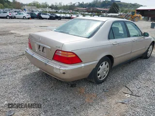 2001 Acura RL w/Navigation System z VIN JH4KA96661C002128, wystawiony jako IAAI lot #42000924 z przebiegiem 180 205 mil mil oraz . Historia ofert i sprzedaży dostępna na DreamBid. Obrazek 4.