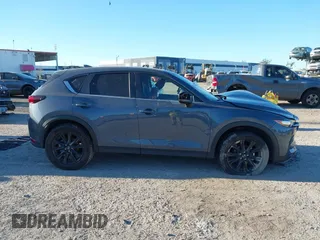 2021 Mazda CX-5 Touring with VIN JM3KFACM1M0371354, listed as a IAAI auction lot 40938490 with 56,172 mi miles. Bid and sale history available at carsss.com. Image 13.